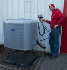 BETHKE technician adjusts heat pump